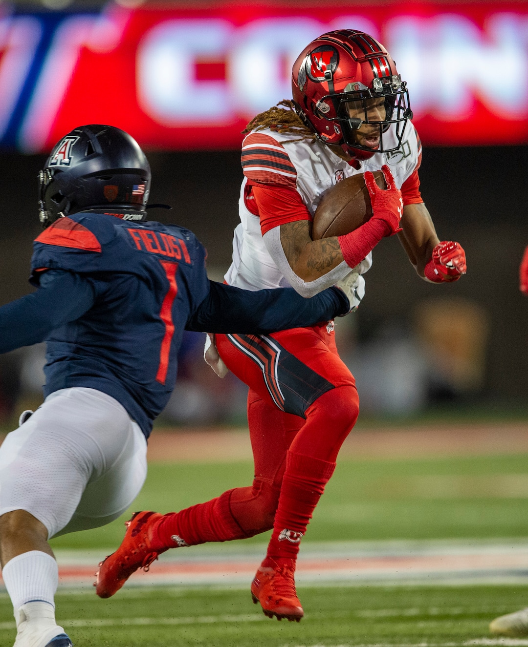(Rick Egan  |  The Salt Lake Tribune)      Utah wide receiver Derrick Vickers (8) runs the ball past Arizona Wildcats linebacker Tony Fields II (1), in PAC-12 action between the Utah Utes and the Arizona Wildcats in Tucson, Saturday, Nov. 23, 2019.