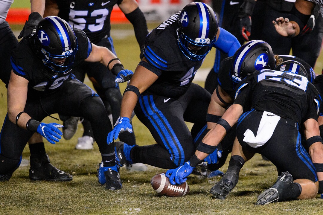 (Trent Nelson  |  The Salt Lake Tribune) BYU recovers a fumble as BYU hosts San Diego State, NCAA football in Provo on Saturday, December 12, 2020.