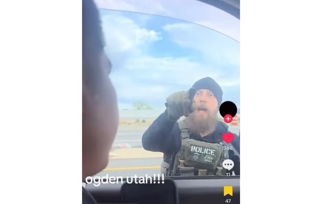 (Screenshot) An agent with U.S. Immigration and Customs Enforcement worked with a Utah Highway Patrol trooper on Monday, March 30, 2026, to arrest three individuals near Ogden. The screenshot comes from a video taken by one of the individuals and posted on social media.
