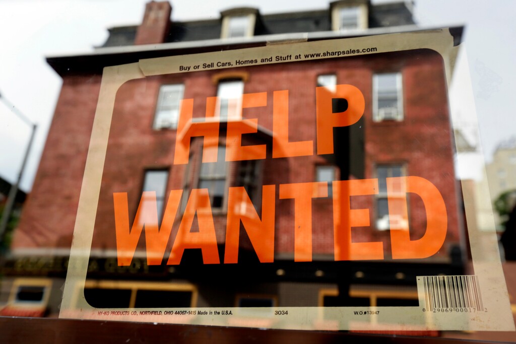 FILE - In this Aug. 19, 2013 file photo, a Philadelphia business displays a help wanted sign in its storefront. With the price of oil below $50 a barrel, consumers will have steadily more money to spend, potentially creating job openings at retailers, auto dealers, shipping firms, restaurants and hotels. (AP Photo/Matt Rourke, File)