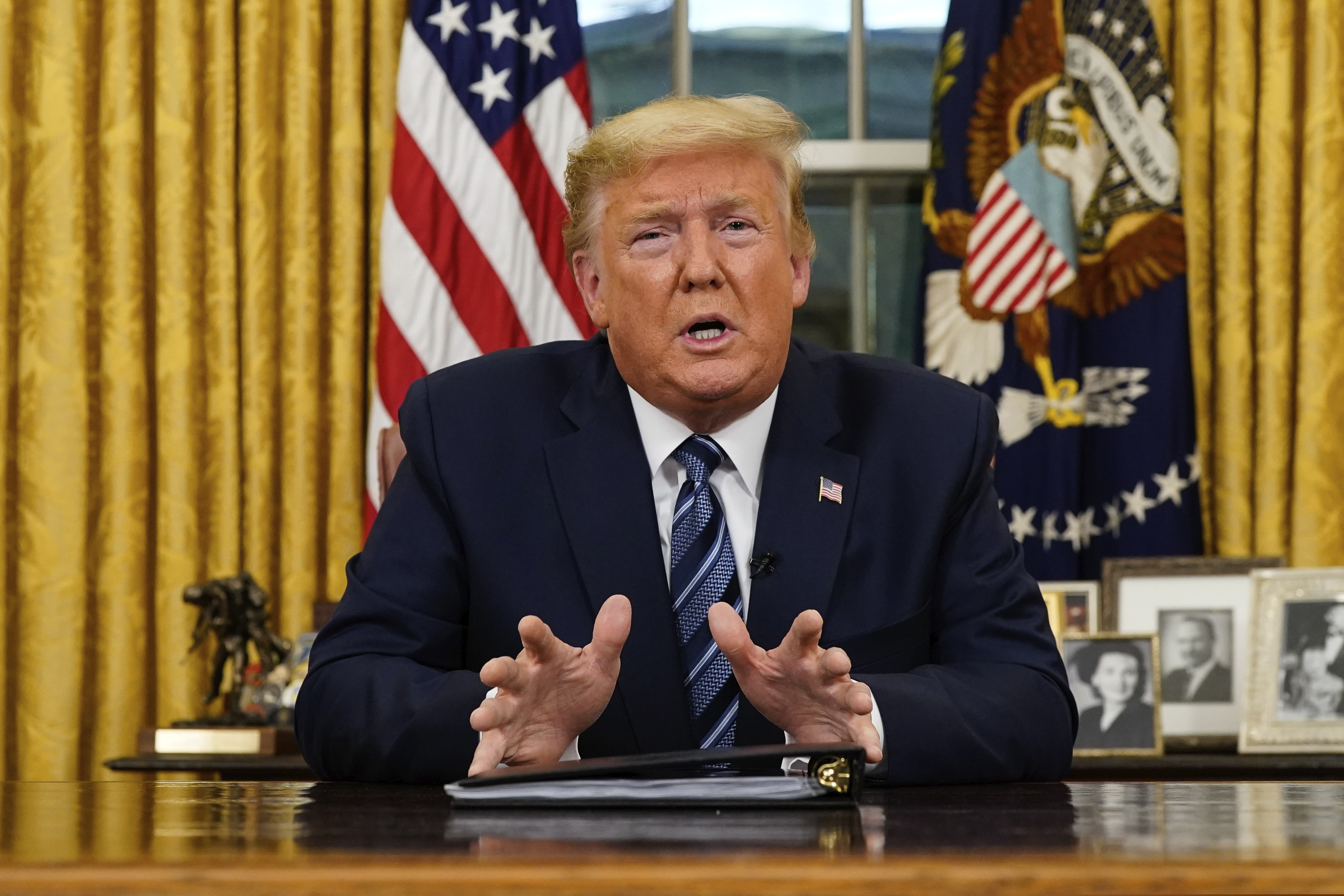 President Donald Trump speaks in an address to the nation from the Oval Office at the White House about the coronavirus Wednesday, March, 11, 2020, in Washington. (Doug Mills/The New York Times via AP, Pool)