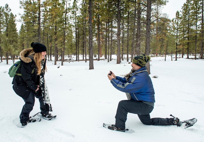 (Rick Egan | The Salt Lake Tribune) Nicole Erdmann reacts as Erik Garcia proposes to her, on a snowshoe tour of the Dixie National Forest during the 36th annual Ruby's Inn Bryce Canyon Winter Festival on Saturday, Feb. 13, 2021. Erdmann and Garcia are from Miami Florida.