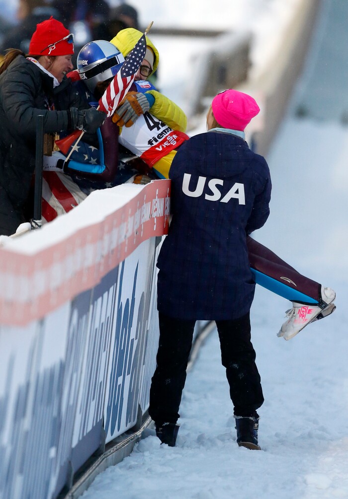 Sarah Hendrickson of the United States celebrates with team members after winning the women's ski jumping HS 106Individual at the Nordic Ski World Championships in Val di Fiemme, Italy, Friday, Feb. 22, 2013.  (AP Photo/Matthias Schrader)