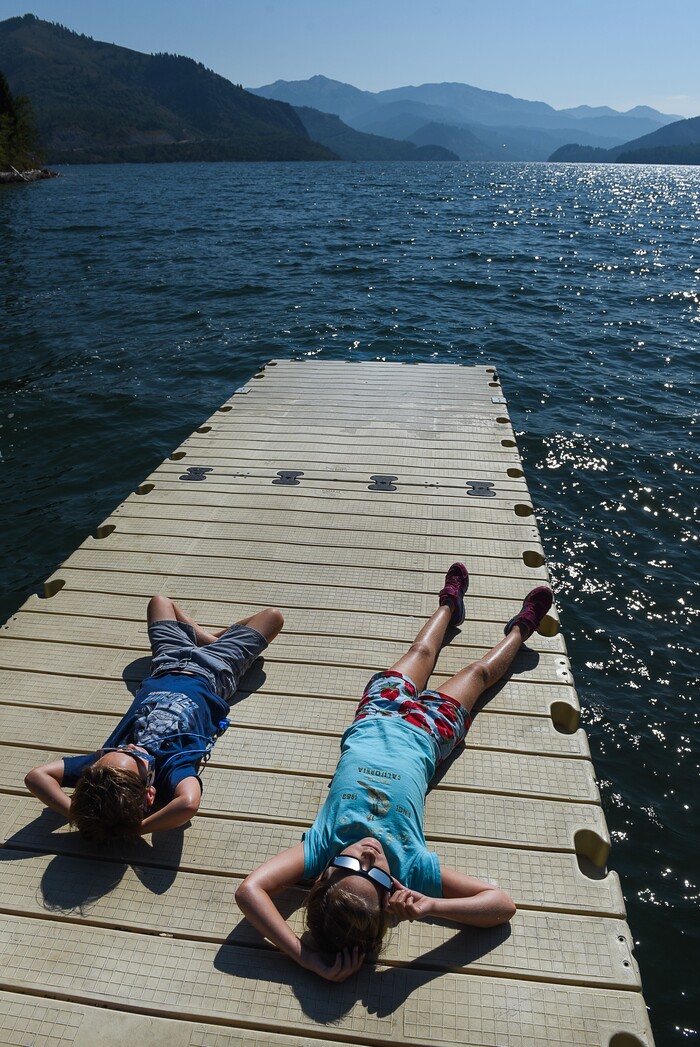 (Francisco Kjolseth  |  The Salt Lake Tribune)  Gavin Wechsler, 6, and his sister Sarina, 9, of Huntington Beach, CA, take in the total eclipse of the sun from a floating dock at Palisades Reservoir, Idaho, on Monday, August 21, 2017.