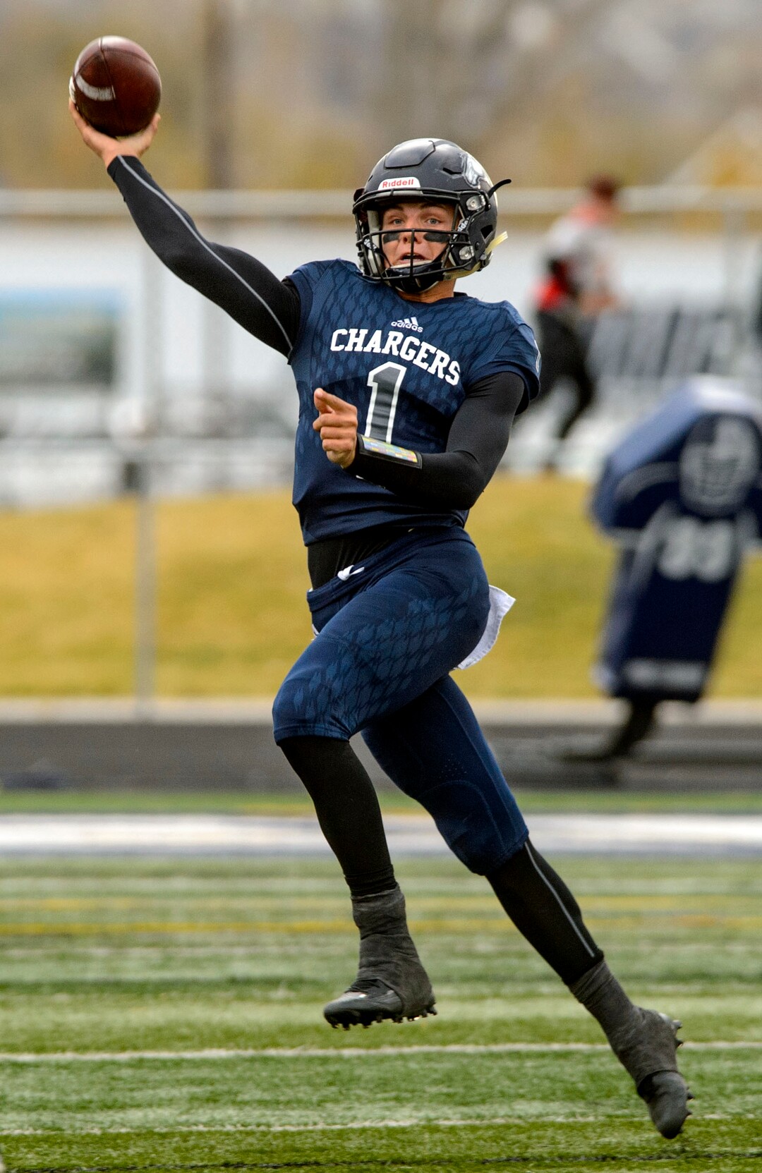 (Steve Griffin  |  The Salt Lake Tribune)  Corner Canyon quarterback Zach Wilson scrambles away from the Highland rush and fires a pass downfield during the Class 5A state quarterfinal football game at Corner Canyon in Draper Friday November 3, 2017.