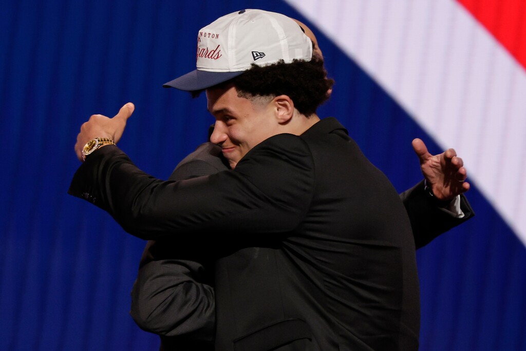 (Adam Hunger | AP) Walter Clayton Jr. is greeted by NBA commissioner Adam Silver after being selected 18th in the first round of the NBA draft, Wednesday, June 25, 2025, in New York. 