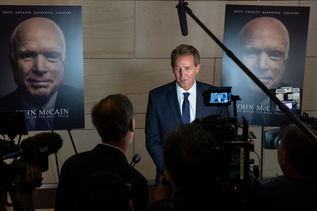 Sen. Jeff Flake, R-Ariz., speaks about Sen. John McCain, R-Ariz., at an event on Capitol Hill to debut a documentary film about McCain, in Washington, Thursday, May 17, 2018. McCain, currently away from the Senate, was diagnosed in last July with glioblastoma, an aggressive form of brain cancer. (AP Photo/J. Scott Applewhite)