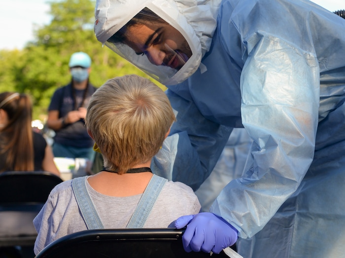 (Chris Samuels | The Salt Lake Tribune) A camper receives a COVID-19 test before leaving for Camp Hope, a camp run by the Salt Lake District Attorney’s office for kids who have been victims of violence, Monday, June 28, 2021.