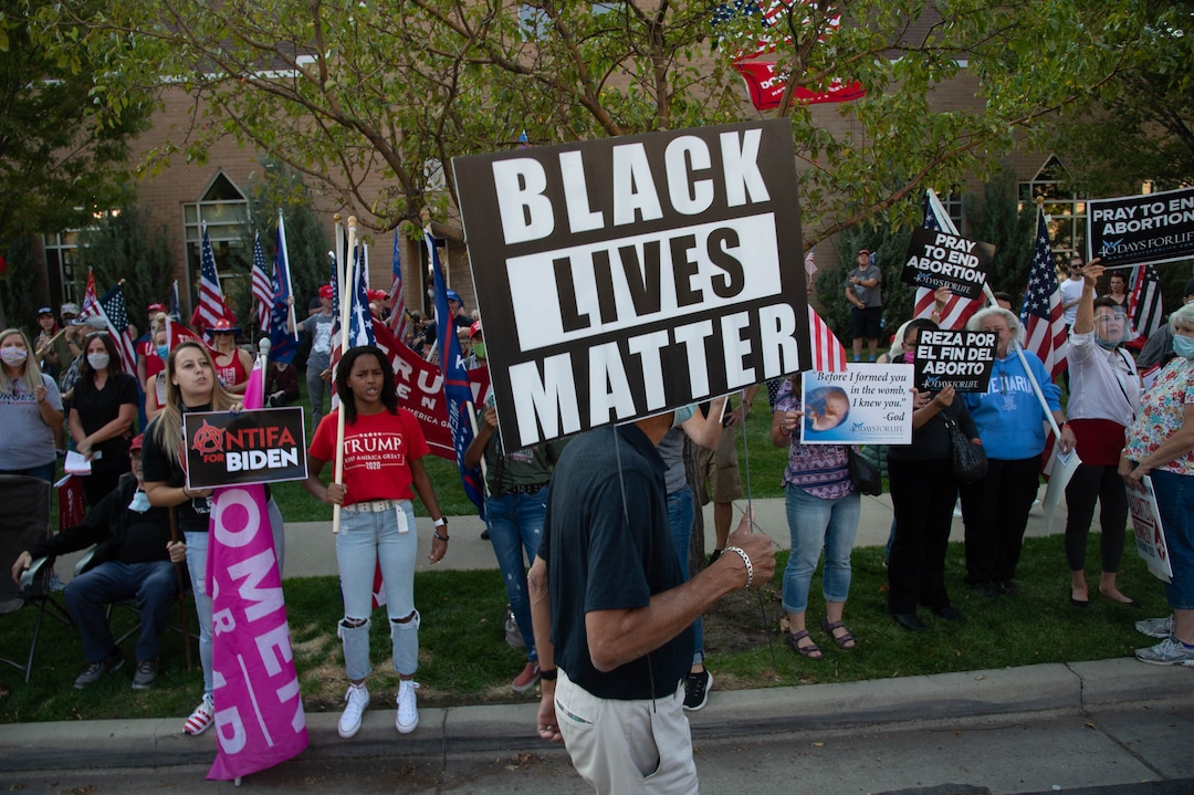 (Francisco Kjolseth  |  The Salt Lake Tribune) Dick Chapa counterprotests supporters of President Donald Trump as they rally outside of Kingsbury Hall on the University of Utah campus in Salt Lake City on Wednesday, Oct. 7, 2020, before the vice presidential debate.