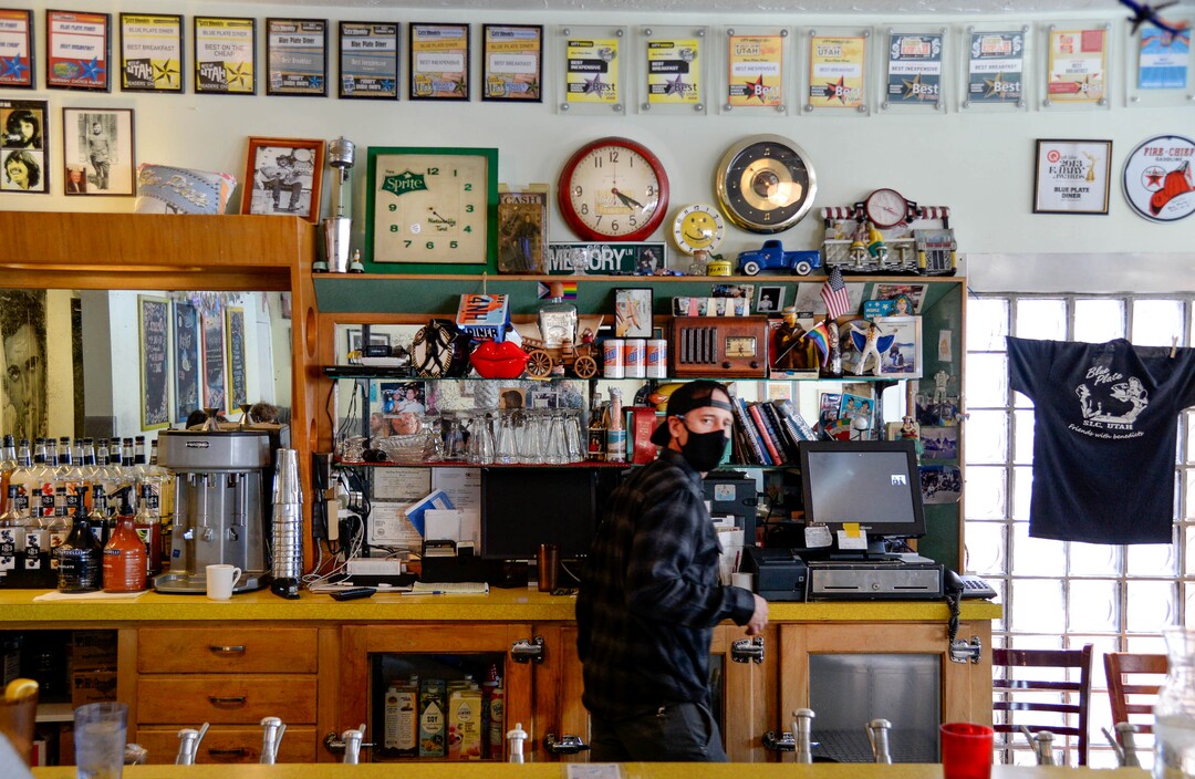 (Francisco Kjolseth  | The Salt Lake Tribune) Blue Plate co-owner Joe Mandl keeps an eye on any needs by patrons from behind the counter that has collected an eclectic collection of memorabilia and awards. The owners recently announced they will be closing on May 4, after 20 years in business. A new development is going in on the corner that is forcing it to shut down.