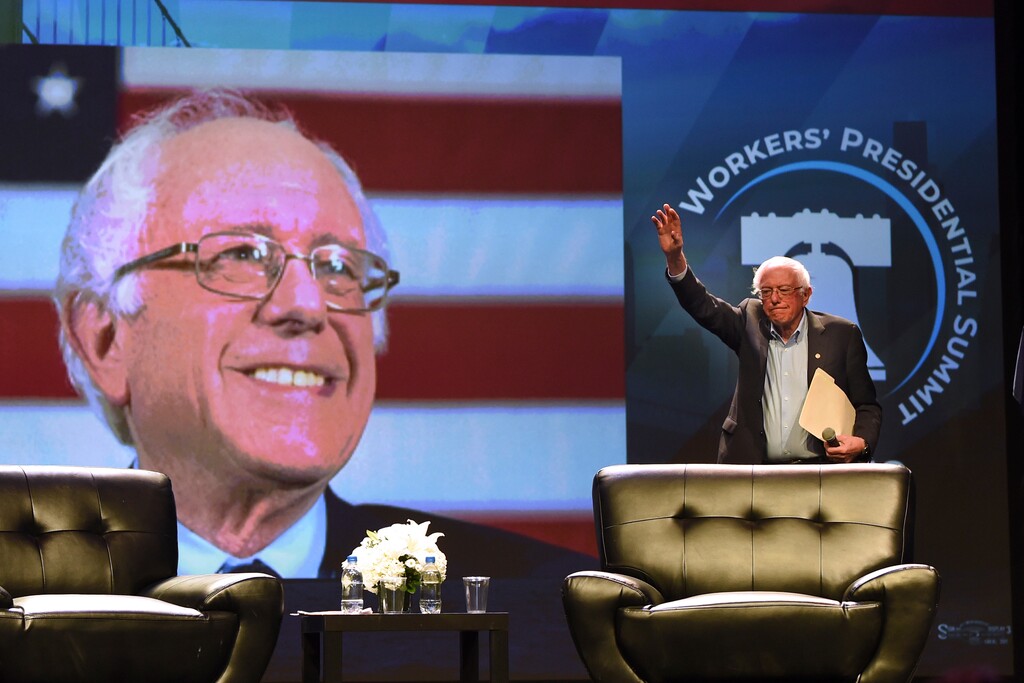Democratic presidential candidate U.S. Sen. Bernie Sanders arrives onstage at the "Workers' Presidential Summit" at the Convention Center in Philadelphia Tuesday, Sept. 17, 2019. The Philadelphia Council of the AFL-CIO hosted the event. (Tom Gralish/The Philadelphia Inquirer via AP)