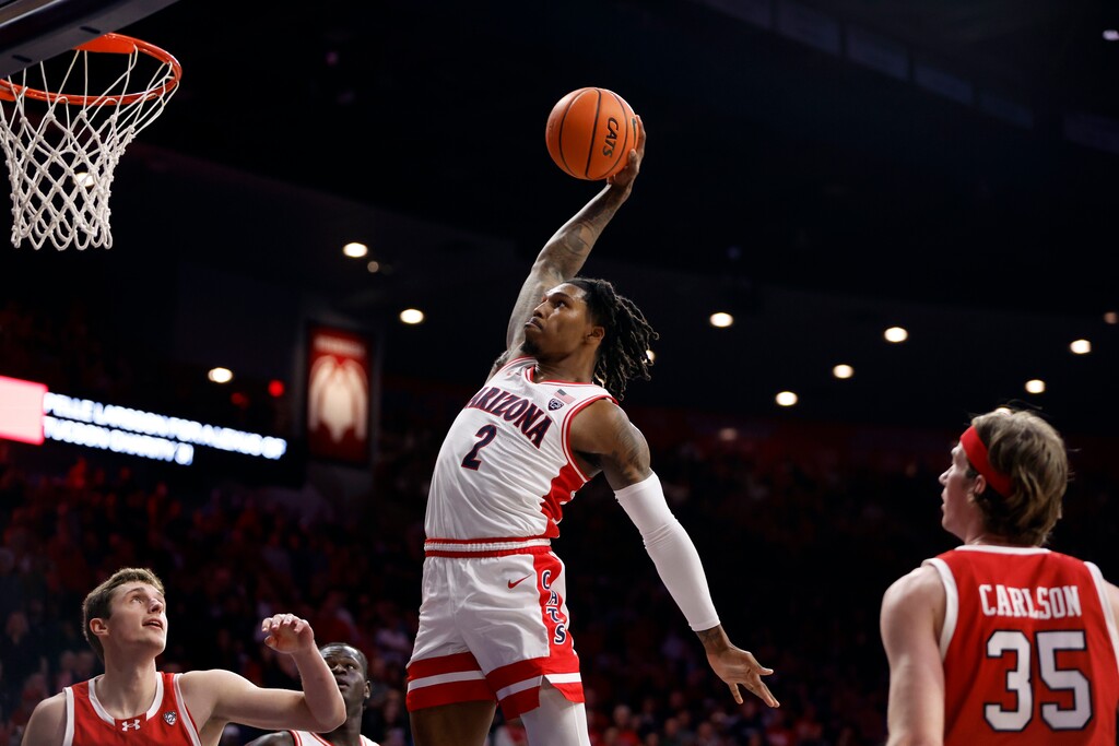 Arizona guard Caleb Love dunks against Utah during the second half of an NCAA college basketball game Saturday, Jan. 6, 2024, in Tucson, Ariz. (AP Photo/Chris Coduto)