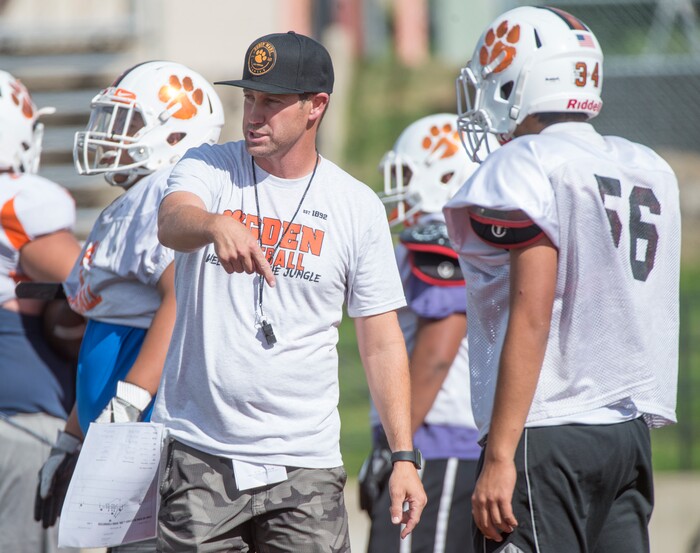 (Rick Egan  |  The Salt Lake Tribune)  Ogden High head coach, Erik Thompson talks to players during football practice. The mood at practice has changed after the team broke its 36-game losing streak last week. Wednesday, September 13, 2017.