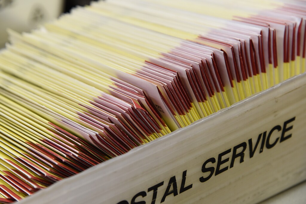 (Francisco Kjolseth  |  The Salt Lake Tribune) Mail-in ballots sit in a box in Salt Lake County. The Summit County election office said Monday that it will need to quarantine through Friday after a coronavirus exposure.