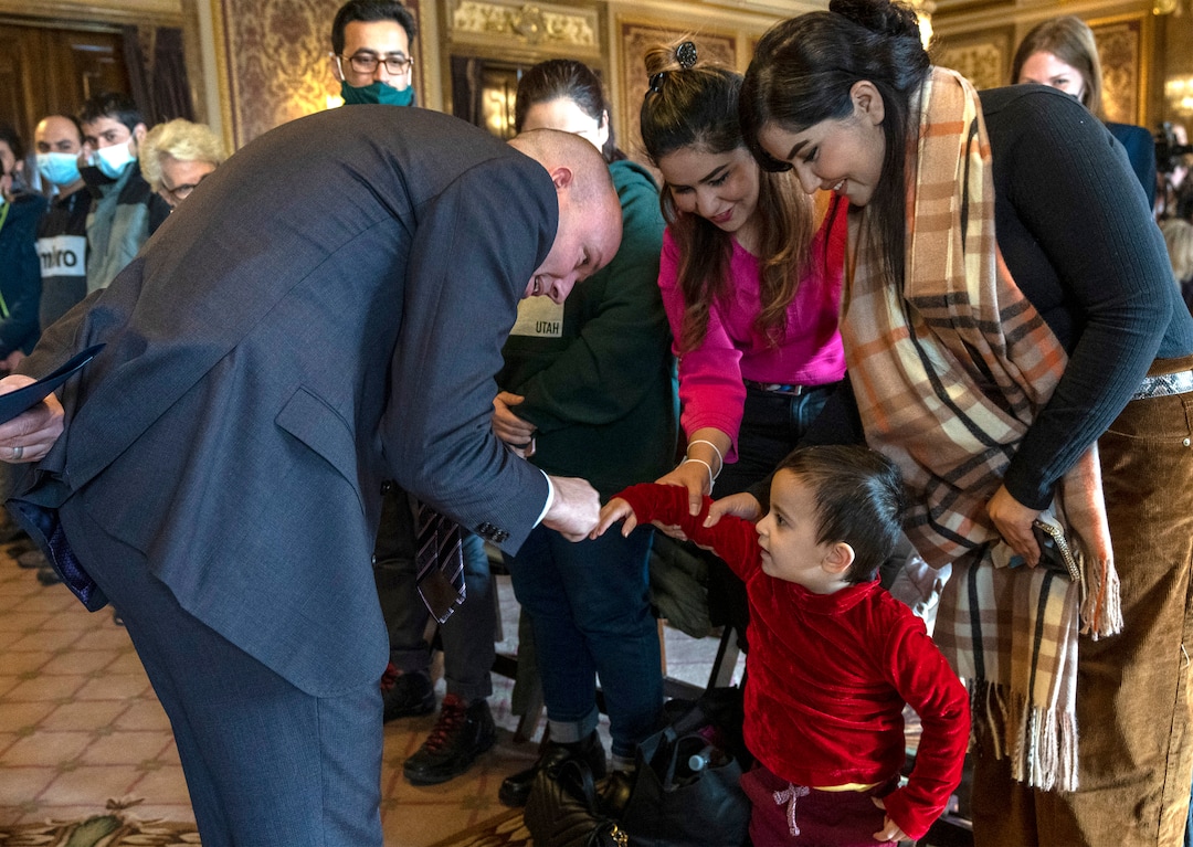 (Rick Egan | The Salt Lake Tribune) Gov. Spencer Cox meets with Afghan refugee sisters, Khatina and Kamila Emami, and 2-year-old Madina Nazari, in the gold Room at the State Capitol before a news conference for "Afghan Day on the Hill" on Wednesday, Feb. 23, 2022.