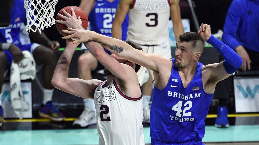(David Becker | AP) BYU center Richard Harward (42) defends against Gonzaga forward Drew Timme during the first half of an NCAA college basketball game for the West Coast Conference men's tournament championship Tuesday, March 9, 2021, in Las Vegas.