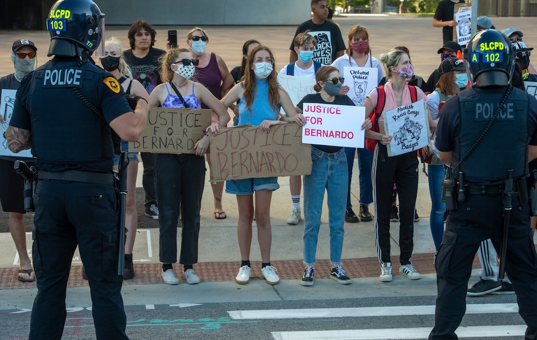 (Rick Egan  |  The Salt Lake Tribune)     Protesters lock arms as they face the Salt Lake City Police during a Justice for Bernardo Palacios-Carbajal protest on Tuesday, June 23, 2020.