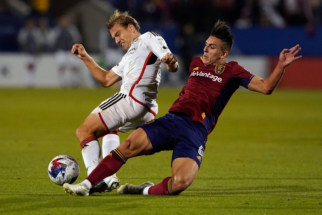 Real Salt Lake midfielder Braian Ojeda (6) and FC Dallas midfielder Paxton Pomykal, left, vie for control of the ball during the second half of an MLS soccer match Saturday, April 15, 2023, in Frisco, Texas. (AP Photo/LM Otero)