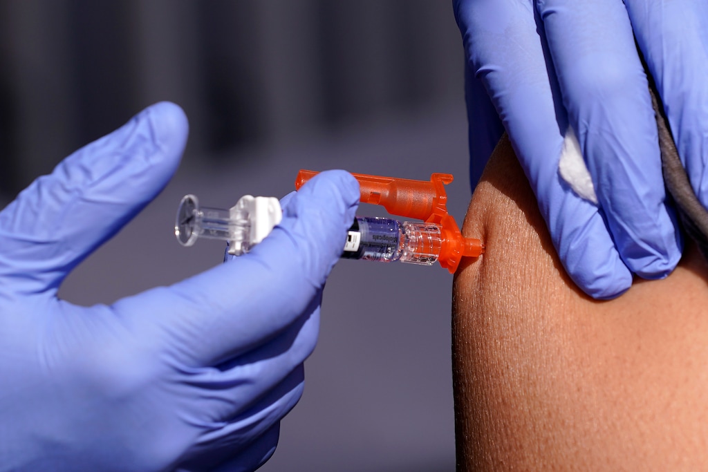 (Mark J. Terrill | AP) A patient is given a flu vaccine on Friday, Oct. 28, 2022, in Lynwood, Calif. Flu season started early this year, adding stress to health care workers already busy with unprecedented RSV cases and the ongoing coronavirus pandemic.