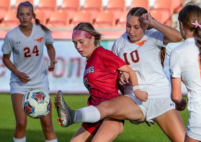 (Leah Hogsten | The Salt Lake Tribune) Mountain Crest's Addyson Sofonia  comes behind Crimson Cliffs' Jaiden Nelson with a kick during the 4A State Soccer Championship game between Mountain Crest High School and Crimson Cliffs High School, Oct. 22, 2021 at Rio Tinto Stadium. Mountain Crest defeated Crimson Cliffs 1-0 in double overtime.