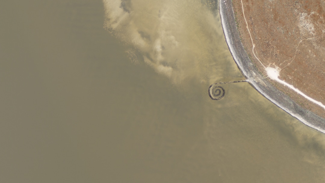 (Planet) A satellite image of the Spiral Jetty, in the north end of the Great Salt Lake, taken on July 3, 2011.