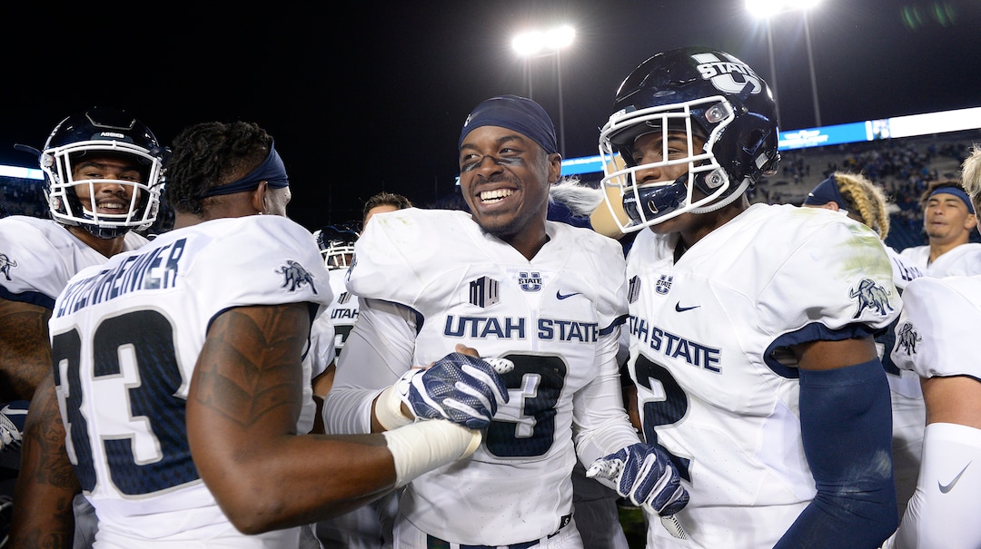Leah Hogsten  |  The Salt Lake Tribune   Utah State Aggies celebrate the win after defeating BYU, 45-20, at Lavell Edwards Stadium in Provo, Friday, Oct. 5, 2018.