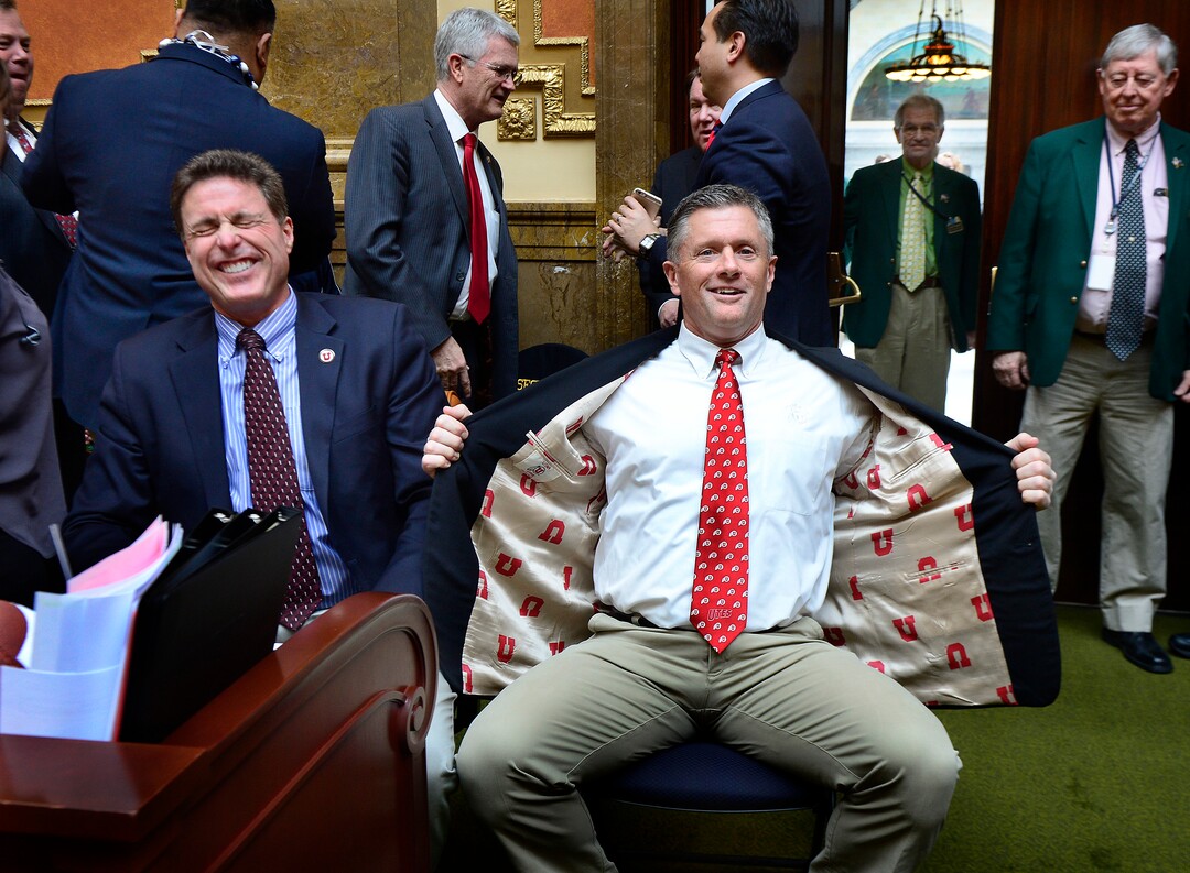 (Scott Sommerdorf | The Salt Lake Tribune) Kyle Whittingham shows off his "U" jacket lining while making a visit at the Utah House of Representatives, Thursday, March 3, 2016.