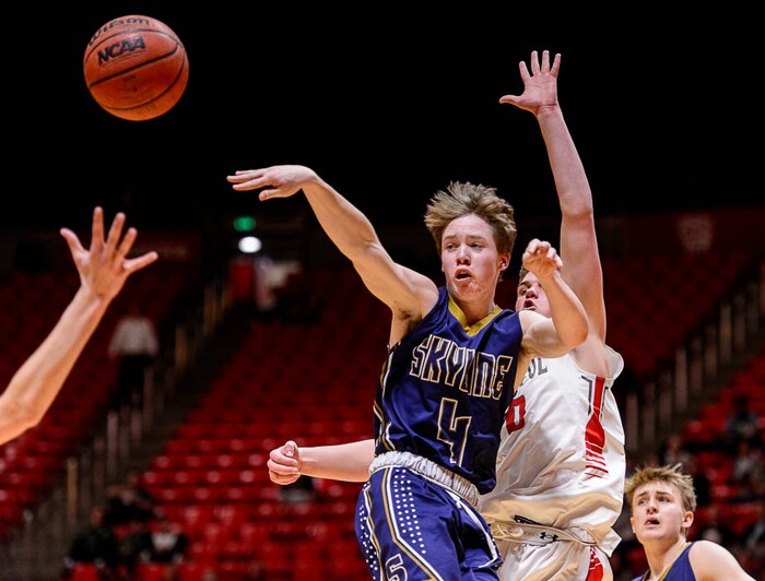 (Trent Nelson | The Salt Lake Tribune)  Skyline vs. Bountiful, 5A State high school basketball tournament at the Huntsman Center in Salt Lake City, Wednesday Feb. 28, 2018. Skyline's Adrian Wilde (4) passes with Bountiful's Brig Willard (10) defending.
