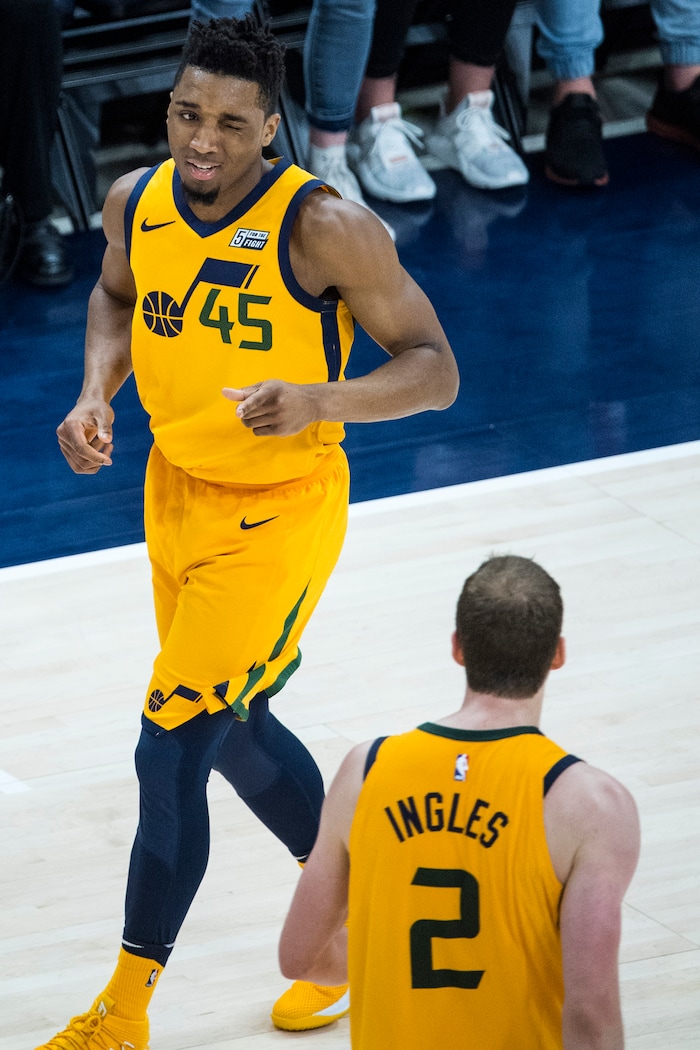 (Chris Detrick  |  The Salt Lake Tribune)  Utah Jazz guard Donovan Mitchell (45) winks at Utah Jazz forward Joe Ingles (2) after scoring a three-pointer during the game at Vivint Smart Home Arena Thursday, March 15, 2018. 
