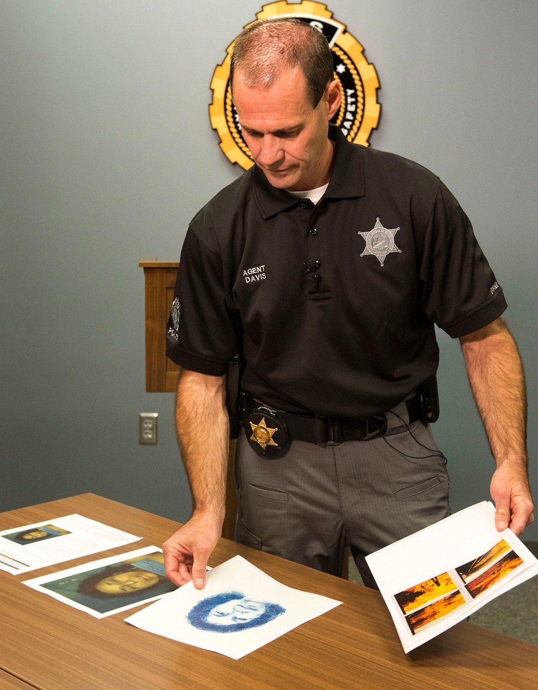 (Rick Egan  |  The Salt Lake Tribune)   Agent Brian Davis, from the Department of Public Safety, displays photos of the victim, as he asks for the public’s help identifying a murder victim in a cold case homicide from April 1998, during a news conference, Tuesday, Oct. 2, 2018.