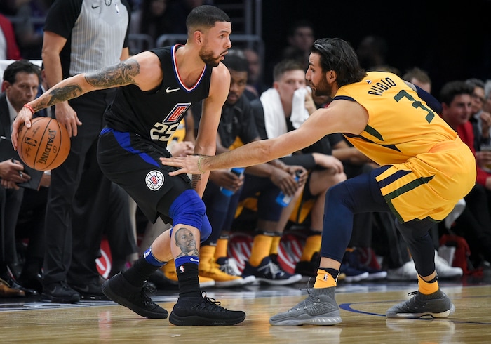Los Angeles Clippers guard Austin Rivers, left, handles the ball as Utah Jazz guard Ricky Rubio defends during the first half of an NBA basketball game in Los Angeles, Thursday, Nov. 30, 2017. (AP Photo/Kelvin Kuo)