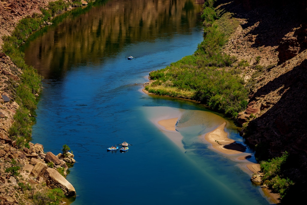 (Trent Nelson  |  The Salt Lake Tribune) Rafts on the Colorado River as seen from Navajo Bridge in Ariz. in May of 2025.