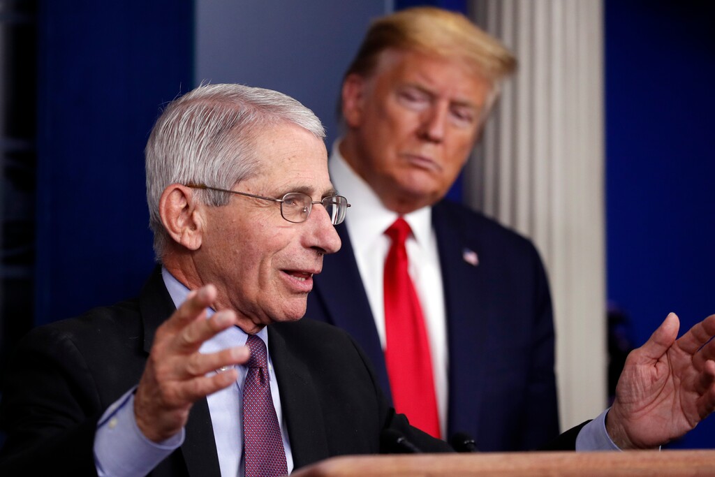President Donald Trump watches as Dr. Anthony Fauci, director of the National Institute of Allergy and Infectious Diseases, speaks about the coronavirus in the James Brady Press Briefing Room of the White House, Wednesday, April 22, 2020, in Washington. (AP Photo/Alex Brandon)