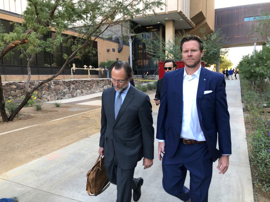 (Jacques Billeaud | AP file photo) In this Nov. 5, 2019 file photo, former Maricopa County Assessor Paul Petersen, right, with his attorney, Kurt Altman, leave after a court hearing in Phoenix. Petersen, who admitted running an illegal adoption scheme in three states involving women from the Marshall Islands, was sentenced in Arkansas to six years in federal prison on Tuesday, Dec. 1, 2020. It was the first of three punishments he’ll face for arranging adoptions prohibited by an international compact.