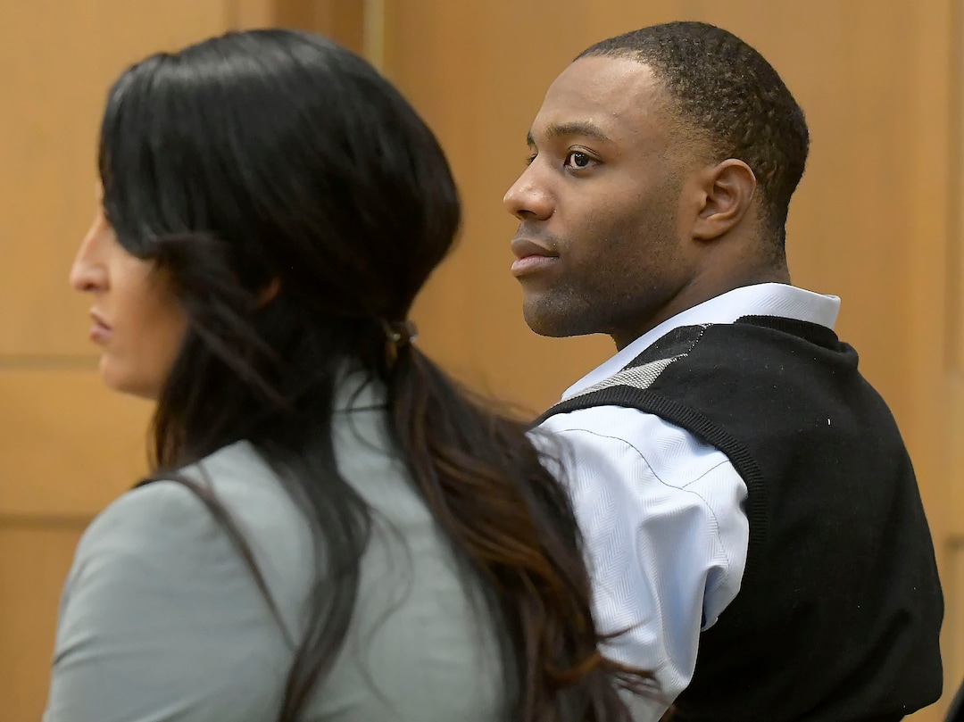 Torrey Green and his lawyer Skye Lazaro listen as the judge announces that closing arguments will be held the next day during his rape trial, Wednesday, Jan.16, 2019 in Brigham City, Utah. Green is accused of raping multiple women while he was a football player at Utah State University. (Eli Lucero/Herald Journal via AP)