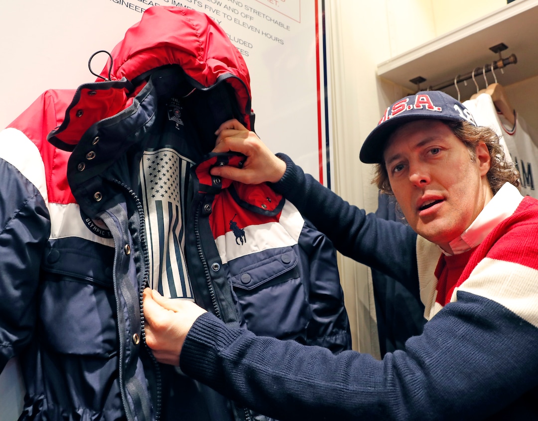 Designer David Lauren displays the heating element inside Polo Ralph Lauren's Team USA's opening ceremony parkas for American athletes participating in the upcoming Olympic games in Pyeongchang, South Korea, Monday, Jan. 22, 2018, in New York. (AP Photo/Kathy Willens)