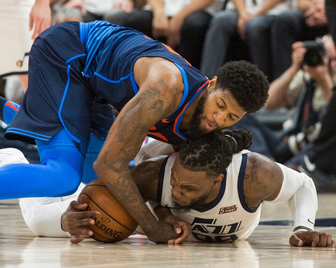 (Rick Egan  |  The Salt Lake Tribune)    Oklahoma City Thunder forward Paul George (13) goes for a loose ball along with Utah Jazz forward Jae Crowder (99), in game 4, NBA playoff action between Utah Jazz and Oklahoma City Thunder, in Salt Lake City, Monday April 23, 2018.