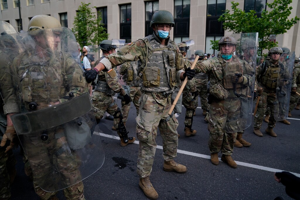 Soldiers with Utah National Guard stand guard as demonstrators gather to protest the death of George Floyd, Wednesday, June 3, 2020, near the White House in Washington. Floyd died after being restrained by Minneapolis police officers. (AP Photo/Evan Vucci)