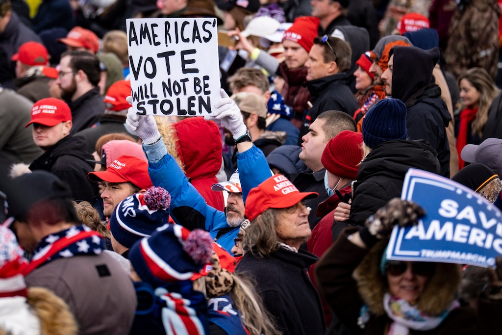 (Pete Marovich | The New York Times)
Supporters hold up signs as President Donald Trump speaks during a rally in Washington on Wednesday, Jan. 6, 2021, protesting the presidential election results. "We must clear an ecosystem of mass delusion spread by Fox News and many Republicans," writes New York Times opinion columnist Nicholas Kristof.