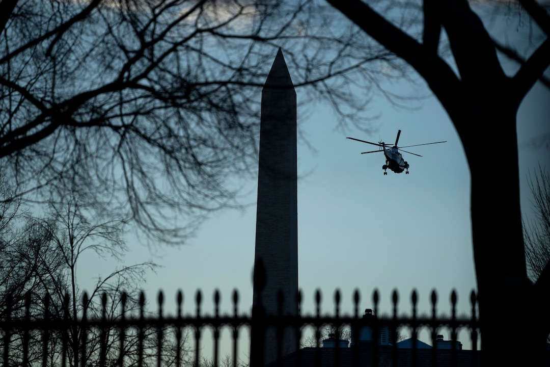 Marine One with President Donald Trump aboard flies past the Washington Monument during Inauguration Day ceremonies, Wednesday, Jan. 20, 2021, in Washington. Trump is en route to his Mar-a-Lago Florida Resort. (AP Photo/Evan Vucci)