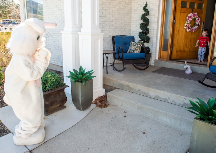 (Rick Egan  |  The Salt Lake Tribune)     Hayden Shaw, 3, is surprised to see the Easter Bunny as he opens the door. Draper City Parks and Recreation workers along with the police and the fire department, delivered more than 30,000 Easter eggs to children at their doorsteps, Friday, April 10.