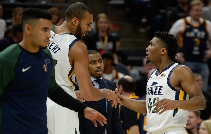 (Francisco Kjolseth  |  The Salt Lake Tribune)  Utah Jazz center Rudy Gobert (27) and Utah Jazz guard Donovan Mitchell (45) talks in the first half of the preseason NBA game at Vivint Smart Home Arena Tuesday, Oct. 2, 2018, in Salt Lake City against the Raptors.