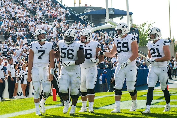 (Chris Detrick  |  The Salt Lake Tribune)  Brigham Young Cougars quarterback Beau Hoge (7) walks off of the field after being tackled for a safety by Wisconsin Badgers linebacker Tyler Johnson (59) during the game at LaVell Edwards Stadium Saturday Saturday, September 16, 2017. Wisconsin Badgers defeated Brigham Young Cougars 40-6.