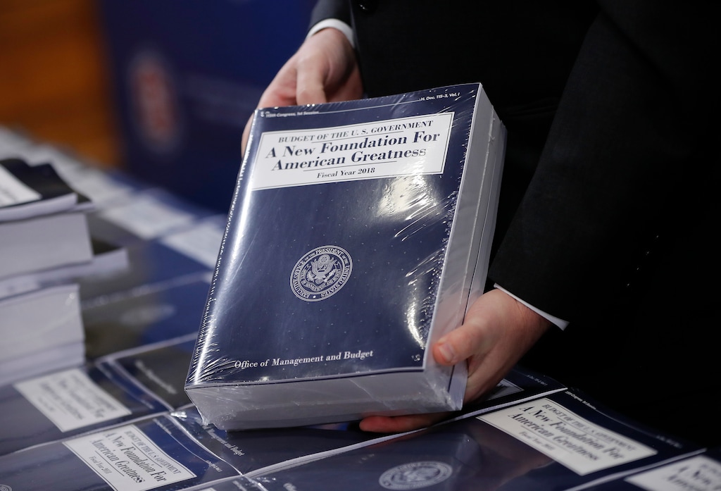 Eric Ueland, Republican staff director, Senate Budget Committee holds a copy of President Donald Trump's fiscal 2018 federal budget, before distributing them to congressional staffers on Capitol Hill in Washington, Tuesday, May 23, 2017. (AP Photo/Pablo Martinez Monsivais)