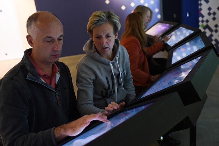 (Francisco Kjolseth  |  The Salt Lake Tribune)  Tim and Nikki Smith of England, work together to solve a new interactive game at the Natural History Museum of Utah at the Rio Tinto Center. The new multiplayer game called Utah Climate Challenge is devised to help visitors consider issues of sustainability, biodiversity, population growth and urban sprawl. Located in the Utah Futures Gallery, the game is designed by Preloaded, a London-based company that specializes in designing games with a purpose to tackle complicated issues for a general audience.