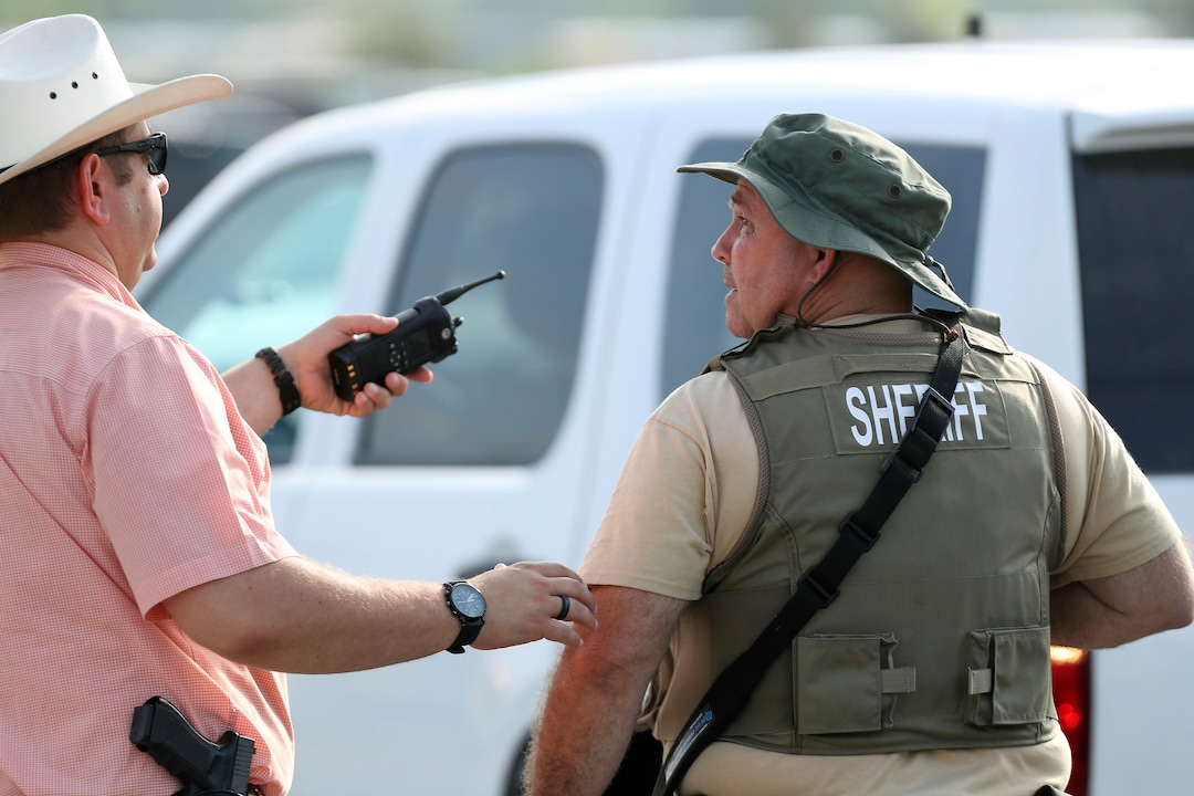Law enforcement officers respond to an active shooter in front of Santa Fe High School Friday, May 18, 2018, in Santa Fe, Texas. (Steve Gonzales/Houston Chronicle via AP)
