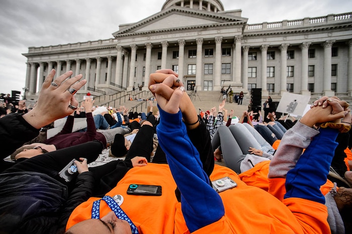 (Trent Nelson | The Salt Lake Tribune)  
High school students staged a die-in at the Utah State Capitol in Salt Lake City to mark the anniversary of the Columbine High School massacre and call for action against gun violence, Friday April 20, 2018.