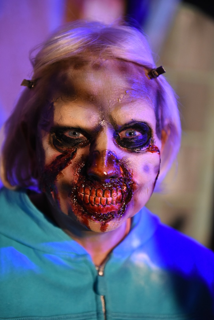 (Francisco Kjolseth  |  The Salt Lake Tribune)  State Senator Karen Mayne undergoes a drastic transformation with the help of makeup artist Jez Roberts as local politicians fall prey to the zombie apocalypse at the Fear Factory on Thursday, Oct. 12, 2017, for a special event to raise awareness of the Utah Food Bank and kick start donations. 