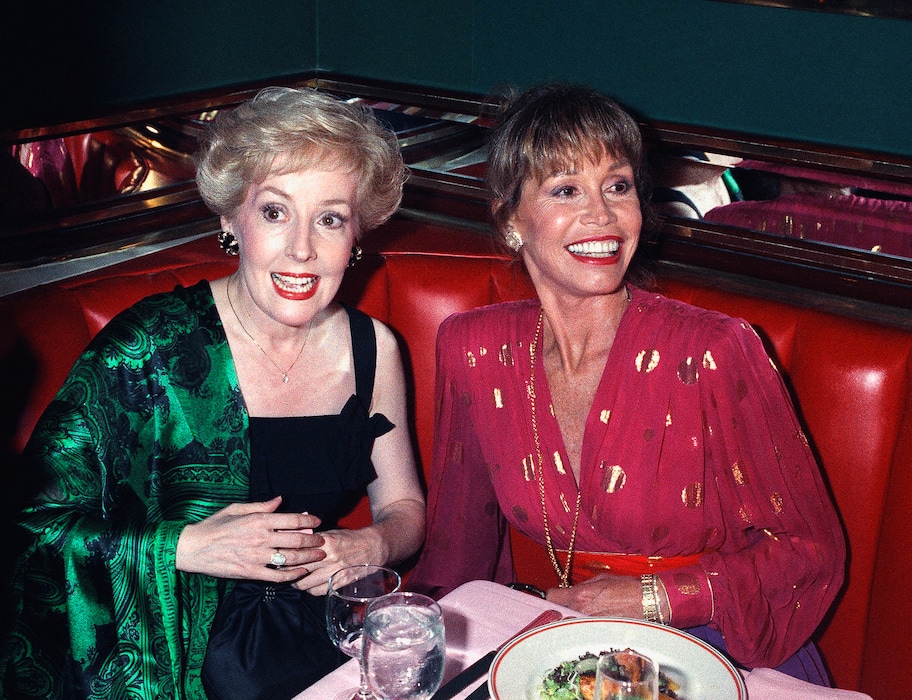 (Malcolm Clarke | The Associated Press) FILE - In this Aug. 30, 1992, file photo, Mary Tyler Moore, right, is joined by former "Mary Tyler Moore Show" co-star Georgia Engel, left, who played Georgette, at New York's Russian Tea Room, as the two reunited during an Emmy Awards screening party Moore hosted at the famous New York restaurant. Engel died Friday, April 12, 2019, in Princeton, N.J., at age 70.