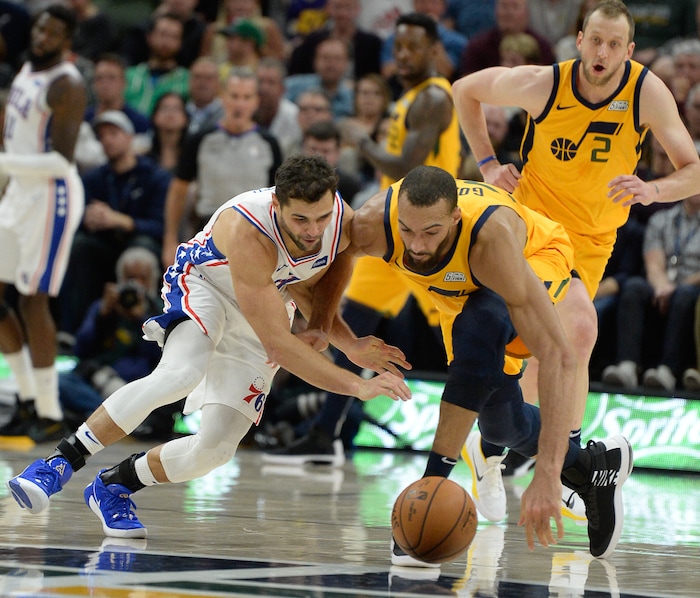 (Francisco Kjolseth  |  The Salt Lake Tribune)  Former Jazz player Philadelphia 76ers guard Raul Neto (19) battles Utah Jazz center Rudy Gobert (27) for a ball as the Utah Jazz host the Philadelphia 76ers in their NBA basketball game at Vivint Smart Home Arena in Salt Lake City on Wed. Nov. 6, 2019.